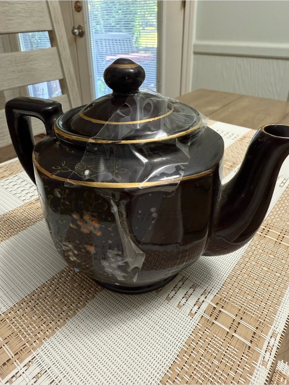 Elegant Black Ceramic Teapot with Gold Trim and Floral Accents